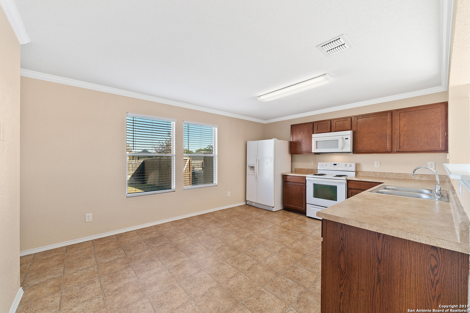 264 Cactus Patch Schertz, TX 78154 - Photo 8 of 25 a view of a kitchen with a sink stove and cabinets