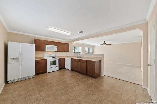a kitchen with stainless steel appliances a sink and counter top