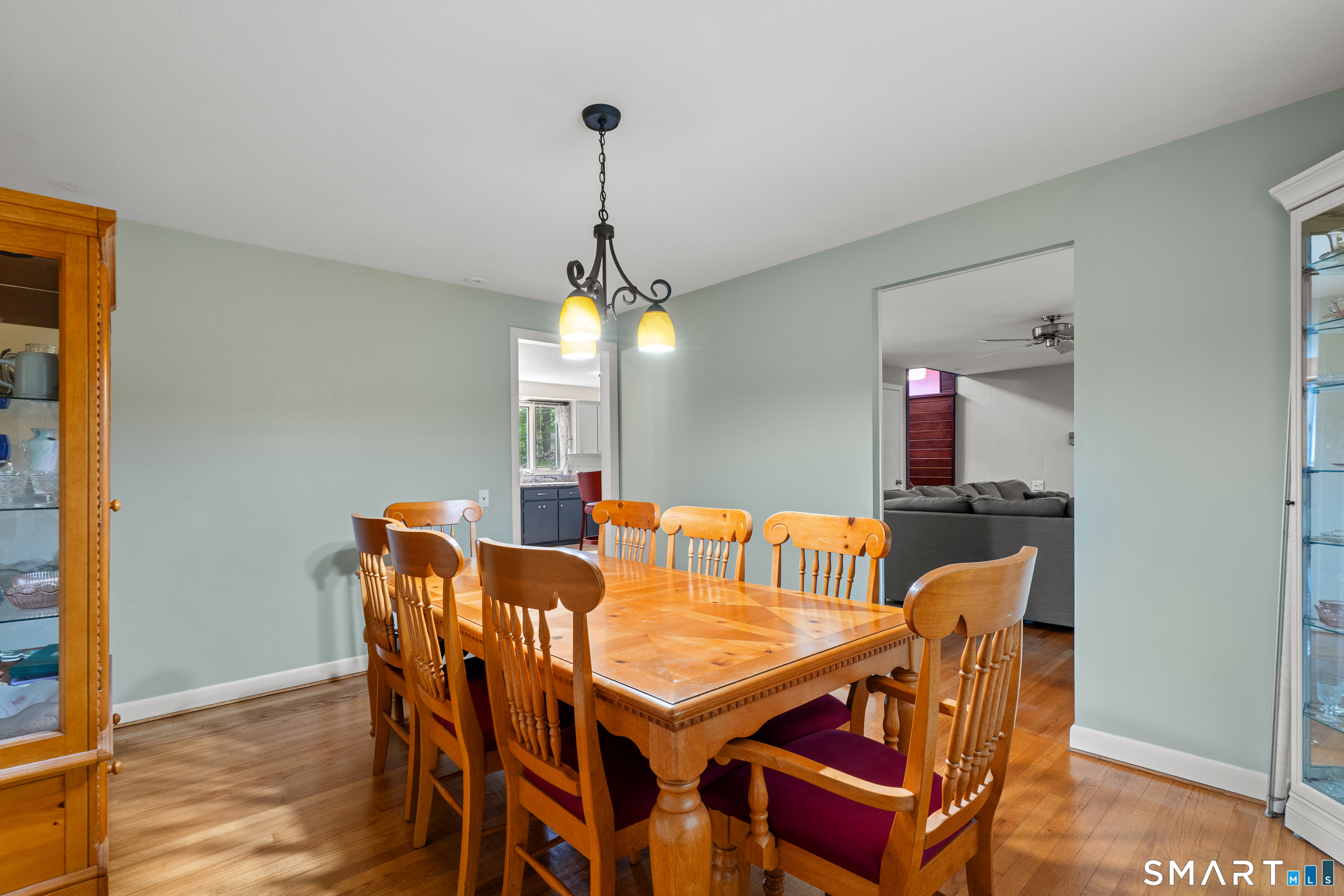 107 Round Hill Road Wethersfield, CT 06109 - Photo 18 of 40 a view of a dining room with furniture and wooden floor