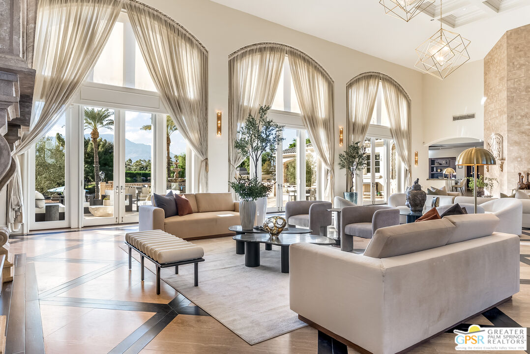 1 St Petersburg Court Rancho Mirage, CA 92270 - Photo 14 of 73 a living room with furniture and a large window