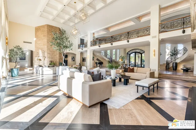 a view of living room with furniture and kitchen view