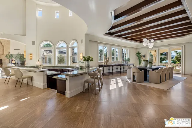 a kitchen with granite countertop a sink and stove