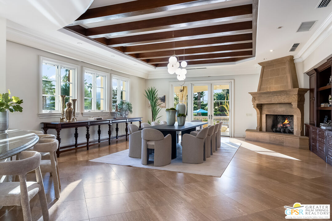 1 St Petersburg Court Rancho Mirage, CA 92270 - Photo 22 of 73 a living room with furniture and a fireplace