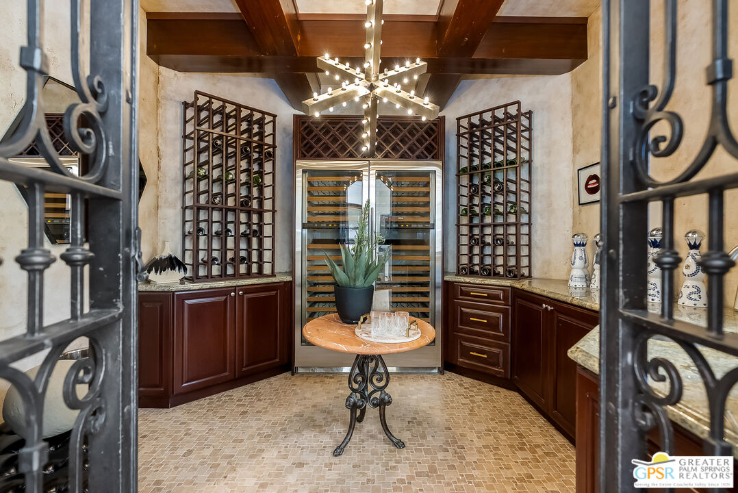 1 St Petersburg Court Rancho Mirage, CA 92270 - Photo 23 of 73 a bathroom with a toilet a sink and a mirror