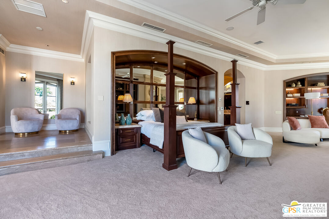 1 St Petersburg Court Rancho Mirage, CA 92270 - Photo 28 of 73 a living room with furniture and a large window