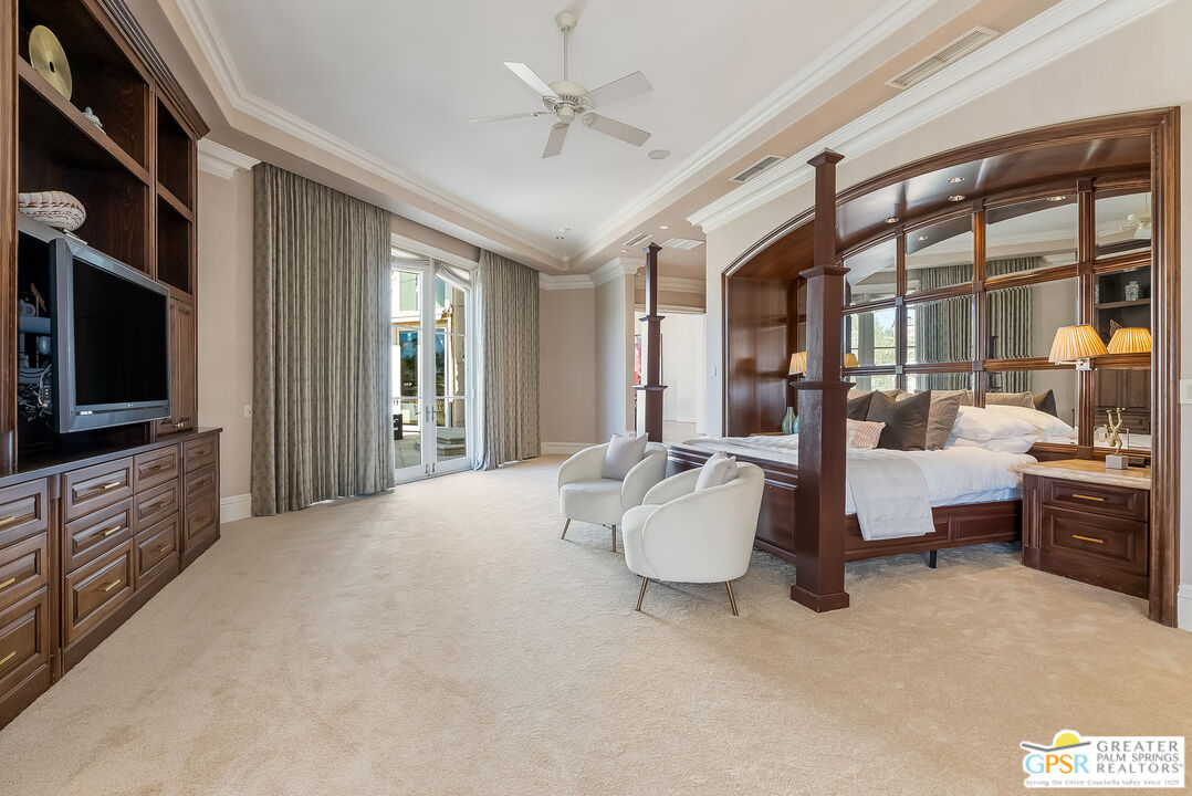1 St Petersburg Court Rancho Mirage, CA 92270 - Photo 29 of 73 a large white bed sitting in a living room next to a window