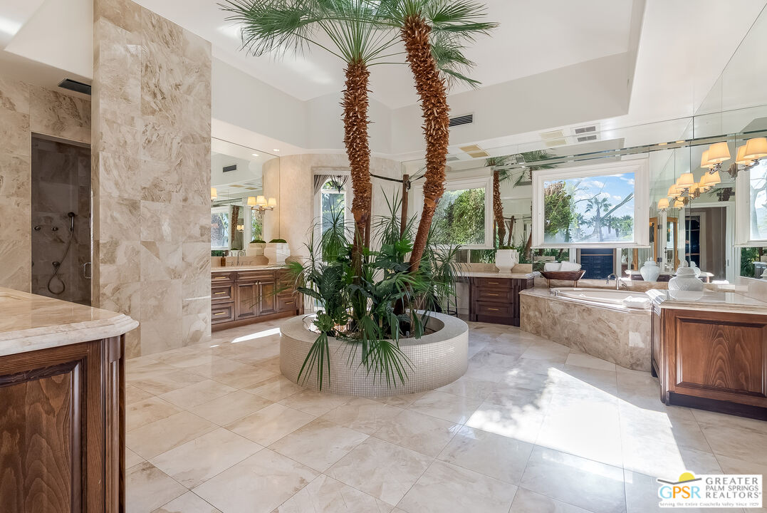 1 St Petersburg Court Rancho Mirage, CA 92270 - Photo 32 of 73 a lobby with furniture and a potted plant