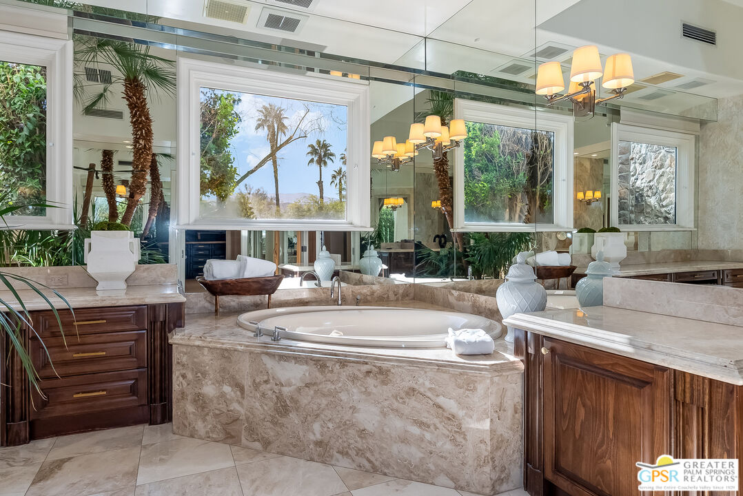 1 St Petersburg Court Rancho Mirage, CA 92270 - Photo 33 of 73 a living room with fireplace furniture and a large window