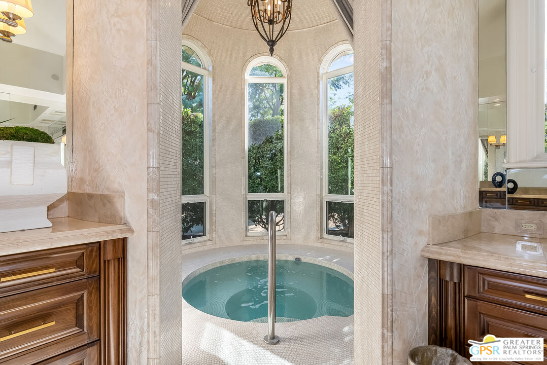 1 St Petersburg Court Rancho Mirage, CA 92270 - Photo 34 of 73 a bath room with a chandelier