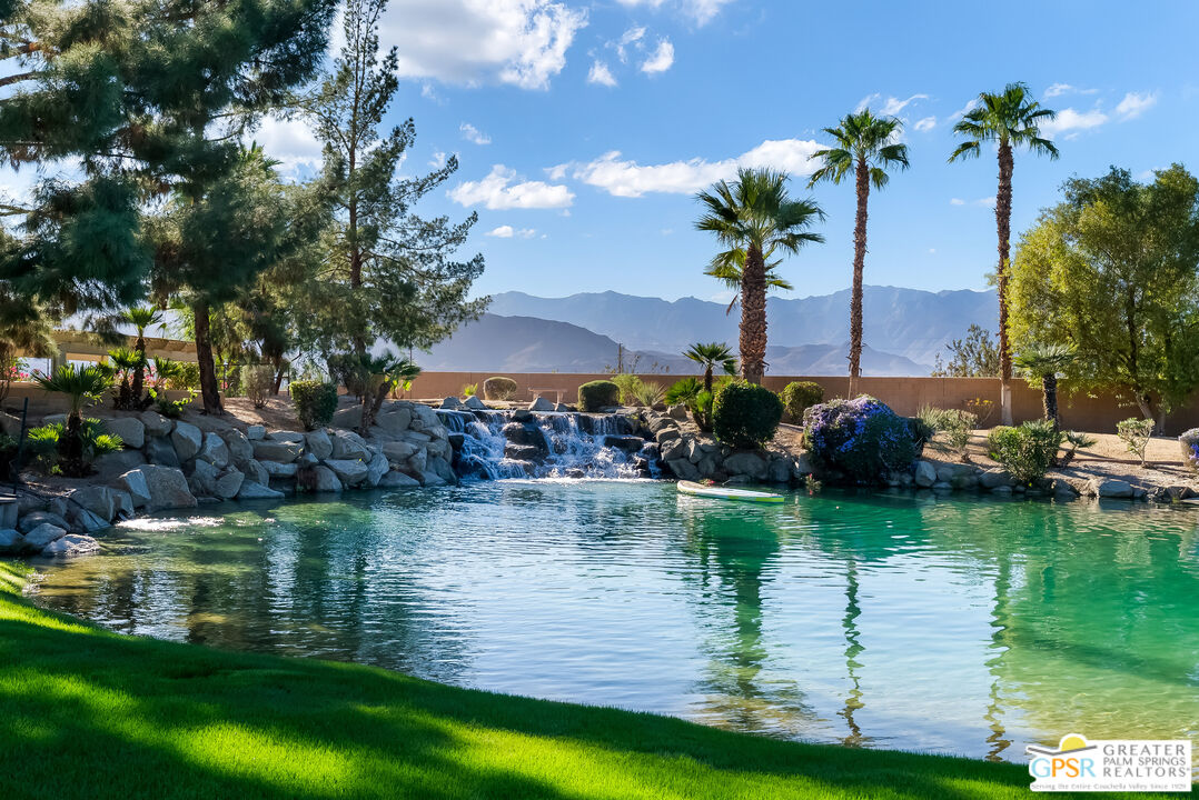 1 St Petersburg Court Rancho Mirage, CA 92270 - Photo 47 of 73 a view of a lake with a garden