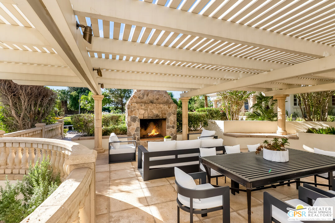 1 St Petersburg Court Rancho Mirage, CA 92270 - Photo 50 of 73 a view of a patio with a dining table and chairs