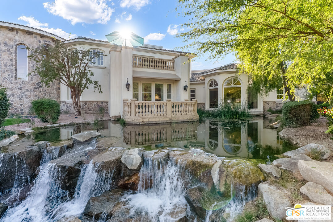 1 St Petersburg Court Rancho Mirage, CA 92270 - Photo 59 of 73 a front view of a house with garden