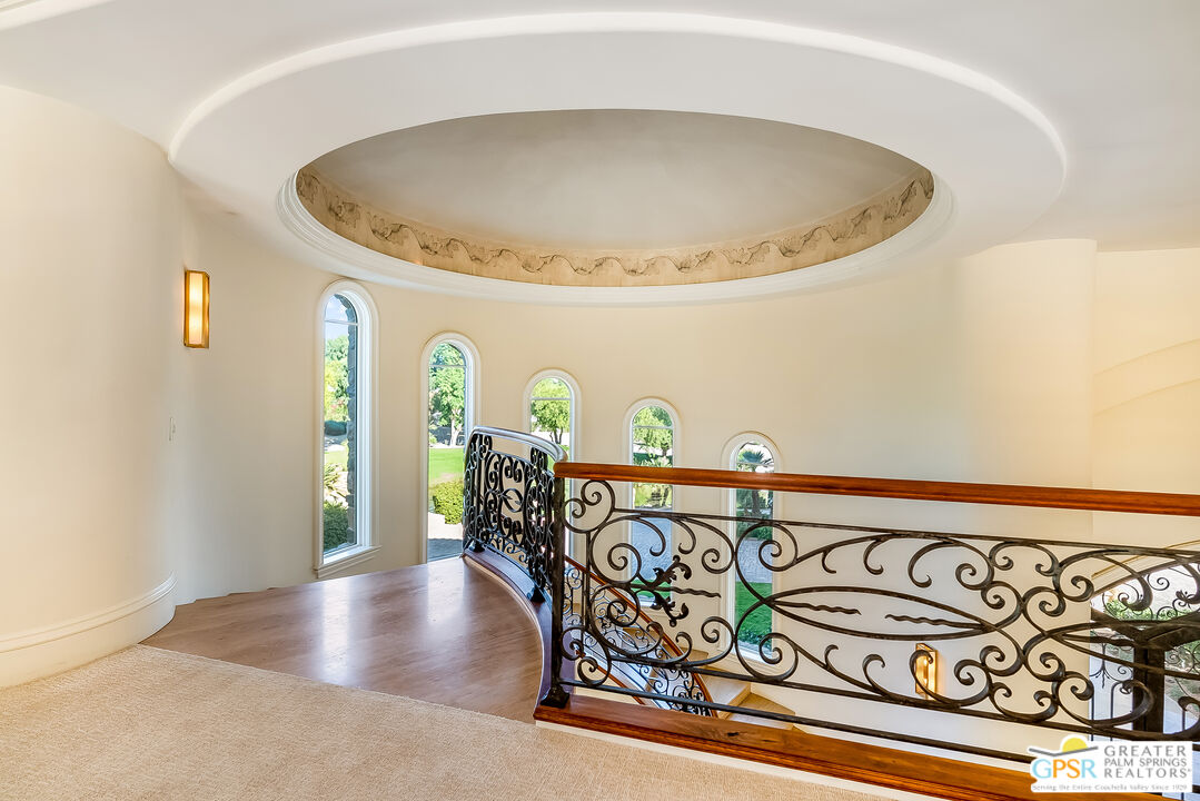 1 St Petersburg Court Rancho Mirage, CA 92270 - Photo 62 of 73 a view of a dining room with furniture and wooden floor