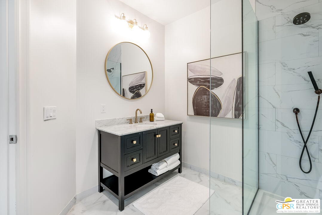 1 St Petersburg Court Rancho Mirage, CA 92270 - Photo 68 of 73 a bathroom with a sink and a mirror