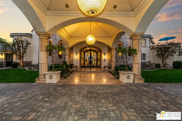 a view of a living room and chandelier