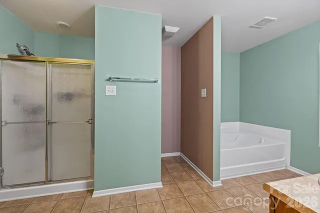 a bathroom with a sink toilet a shower and a mirror