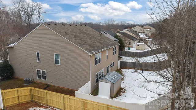 a view of yard and parking