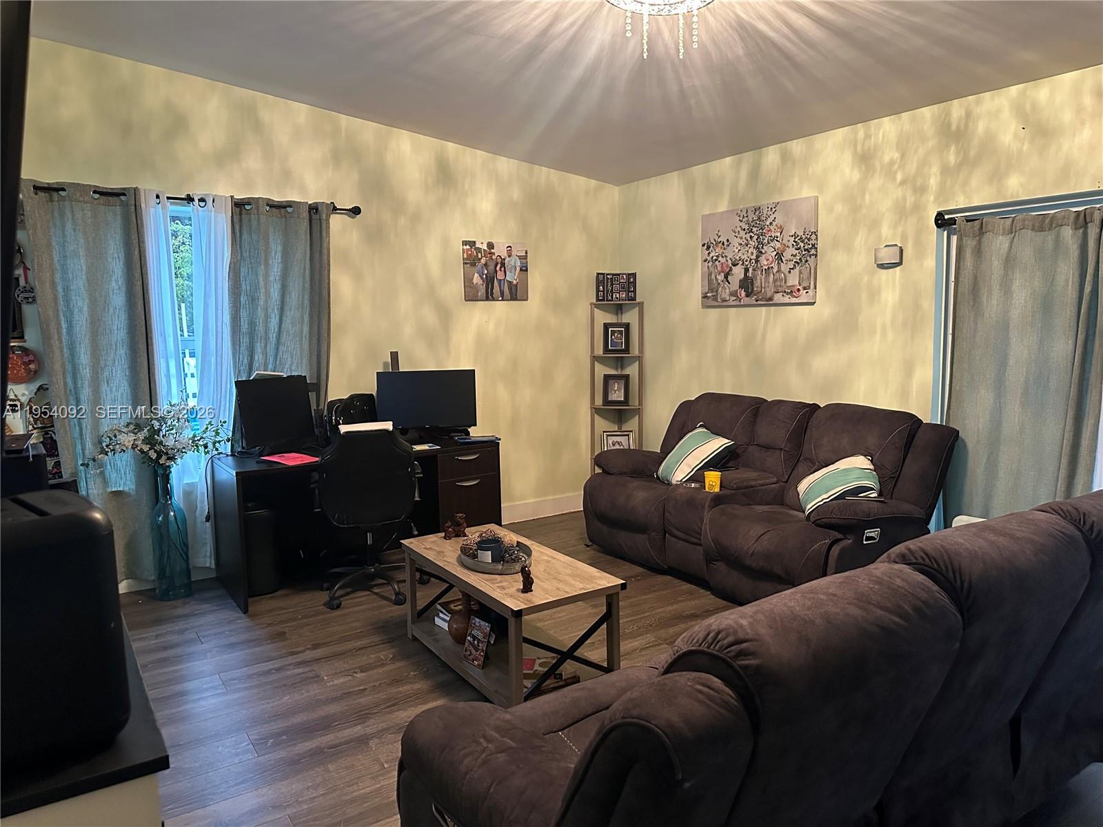 5700 Southwest 54th Terrace Davie, FL 33314 - Photo 13 of 49 a living room with furniture and a flat screen tv