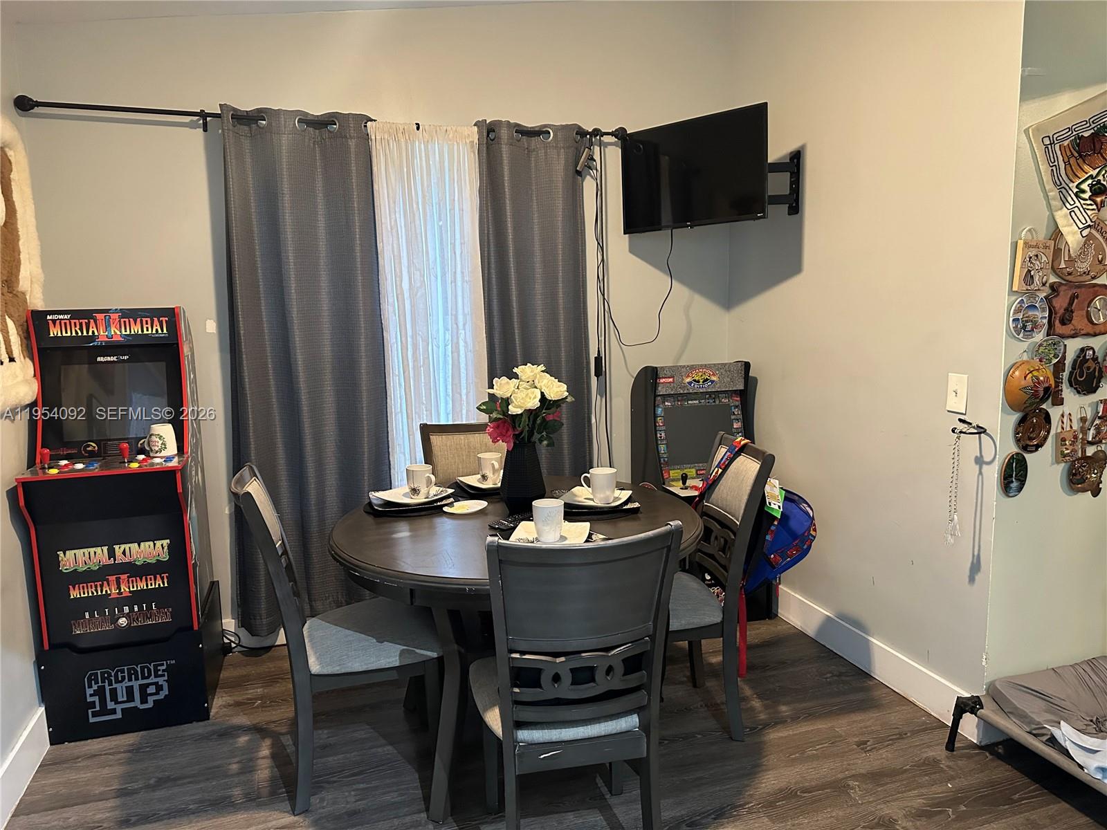 5700 Southwest 54th Terrace Davie, FL 33314 - Photo 17 of 49 a dining room with furniture and wooden floor