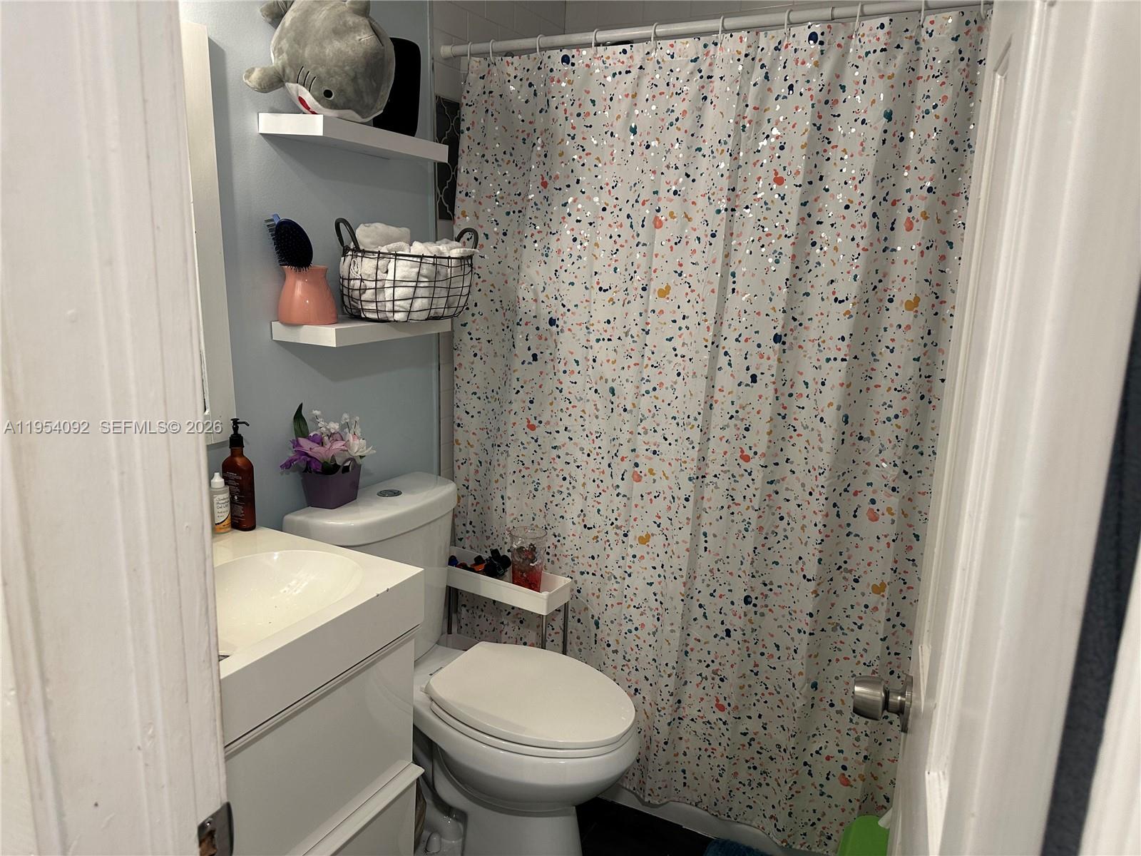 5700 Southwest 54th Terrace Davie, FL 33314 - Photo 19 of 49 a bathroom with a sink and toilet