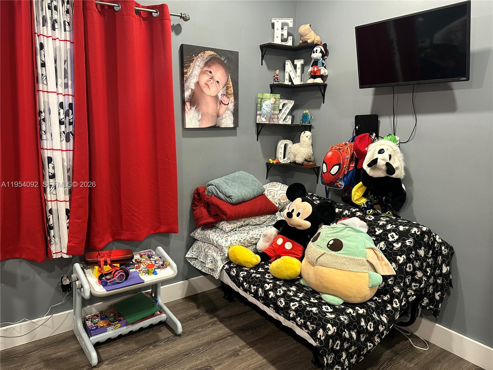 5700 Southwest 54th Terrace Davie, FL 33314 - Photo 28 of 49 a room with toys and a flat screen tv