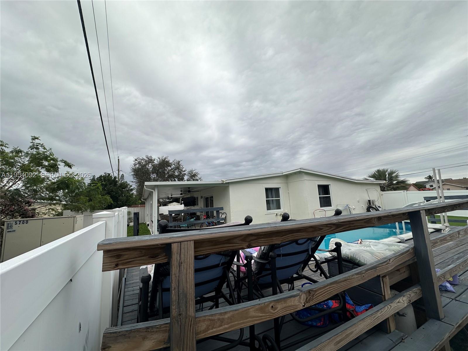 5700 Southwest 54th Terrace Davie, FL 33314 - Photo 33 of 49 a view of a roof deck with wooden fence