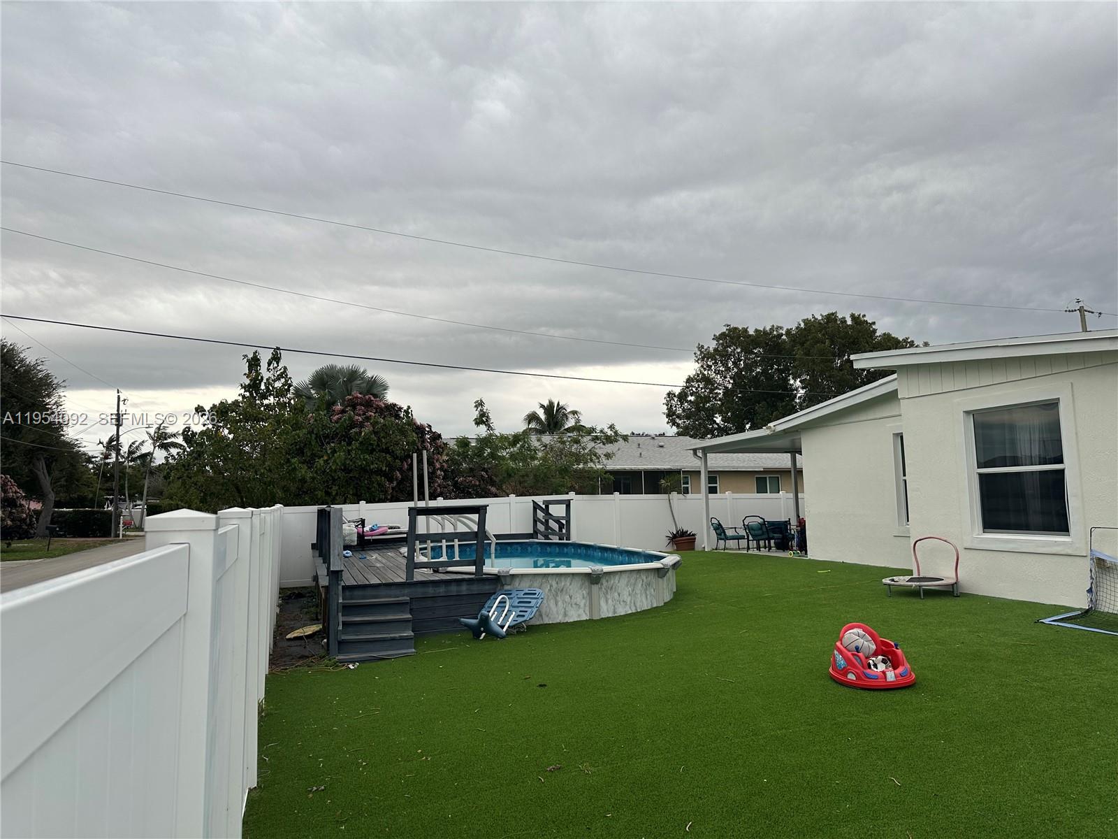 5700 Southwest 54th Terrace Davie, FL 33314 - Photo 37 of 49 a view of backyard with seating area and green space