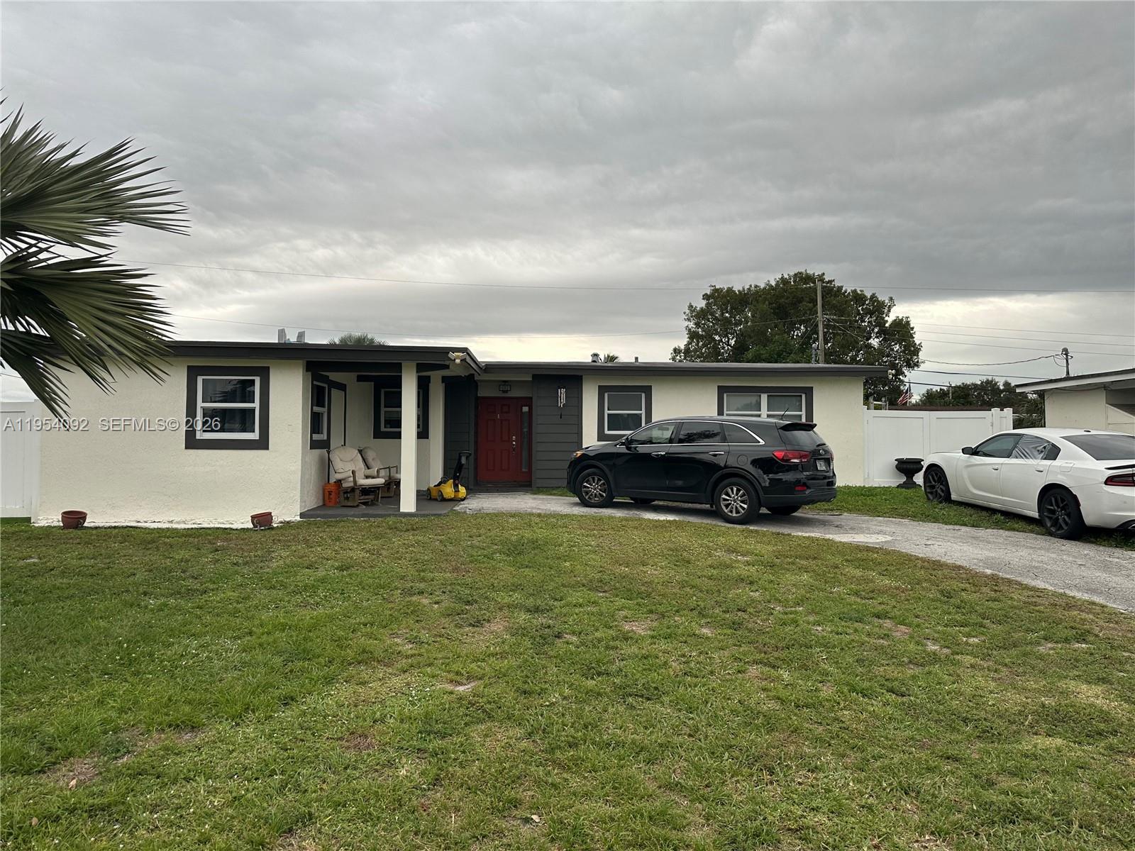 5700 Southwest 54th Terrace Davie, FL 33314 - Photo 7 of 49 a view of a car park in front of house