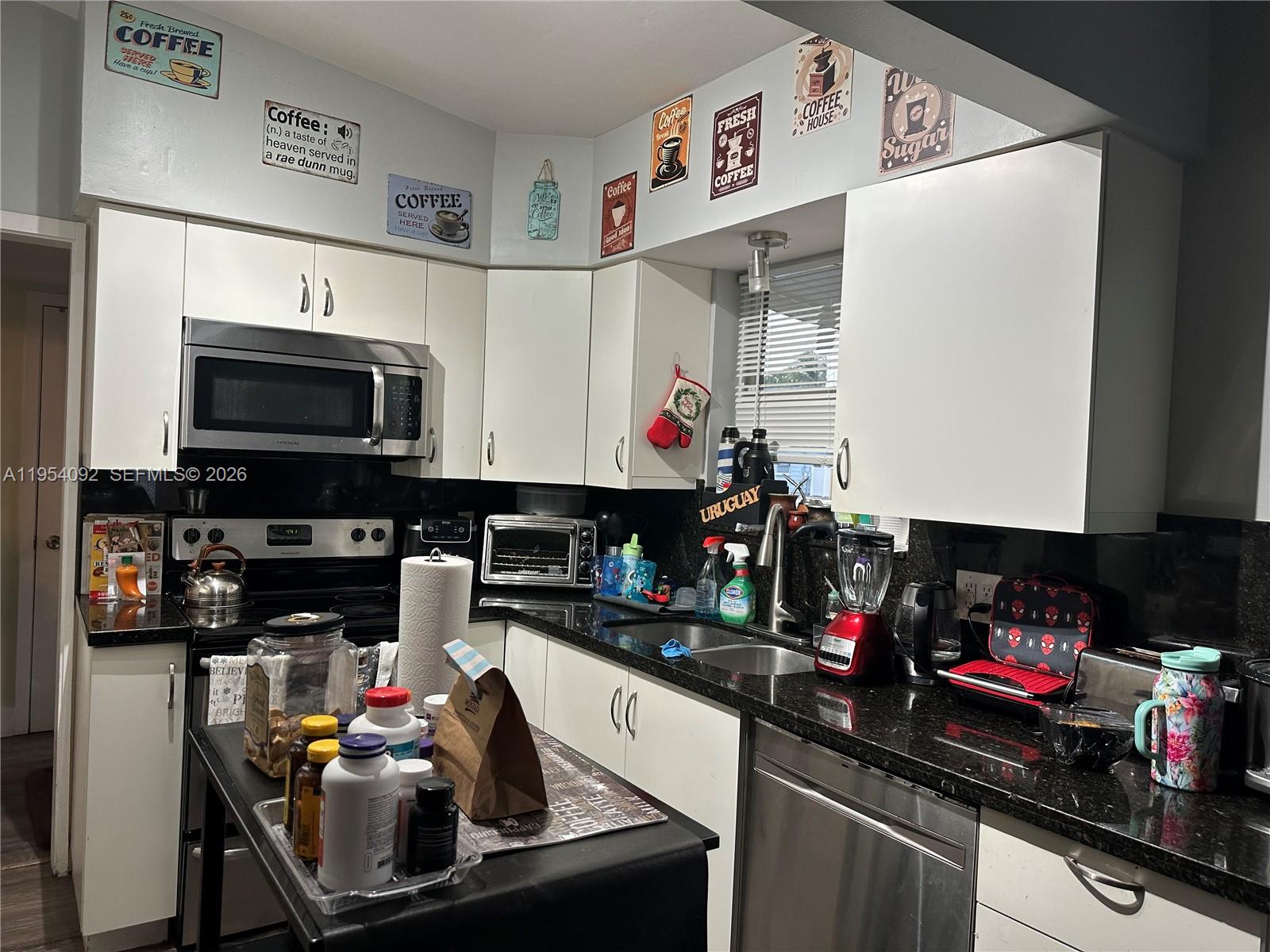 5700 Southwest 54th Terrace Davie, FL 33314 - Photo 10 of 49 a kitchen with a sink appliances and cabinets