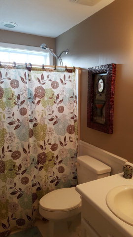 295 North Cross Road Gray, GA 31032 - Photo 20 of 26 a bathroom with a toilet and a shower curtain