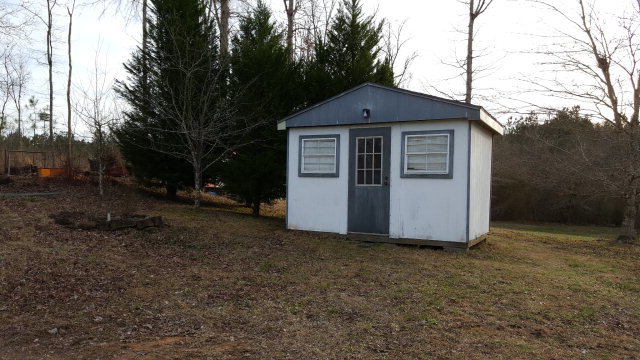 295 North Cross Road Gray, GA 31032 - Photo 24 of 26 a view of a small house with a yard