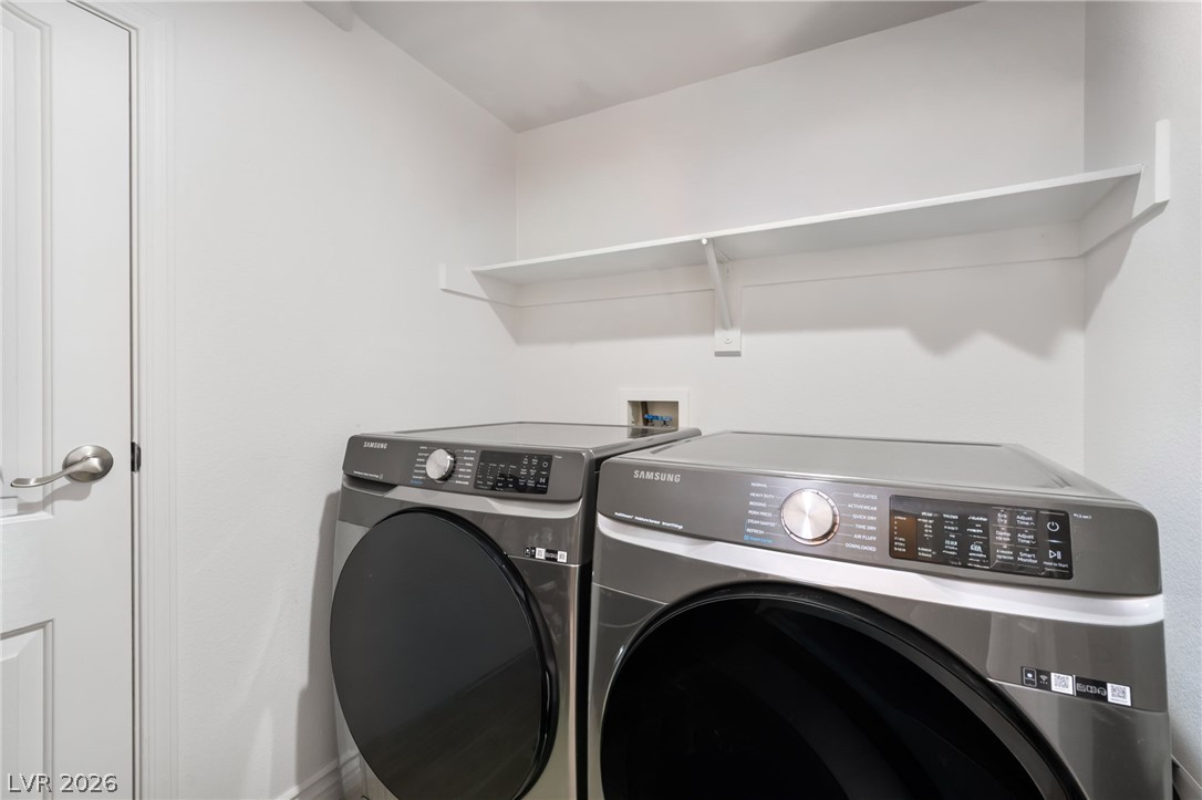 1941 Ivy Point Lane Las Vegas, NV 89134 - Photo 17 of 21 This dedicated laundry space offers practical design and functional appliances for seamless daily chores.