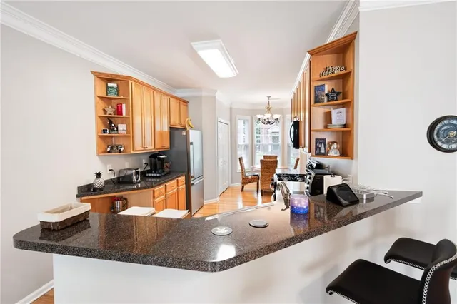 a kitchen with a refrigerator a sink and a stove