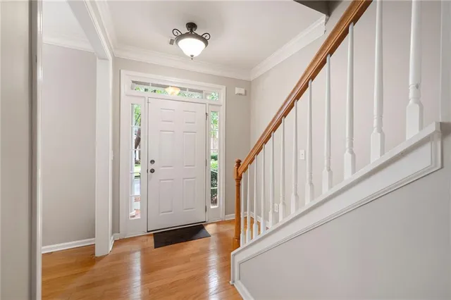 a view of an entryway with wooden floor