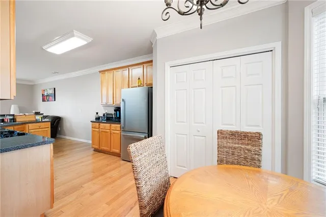 a bedroom with a bed and a refrigerator