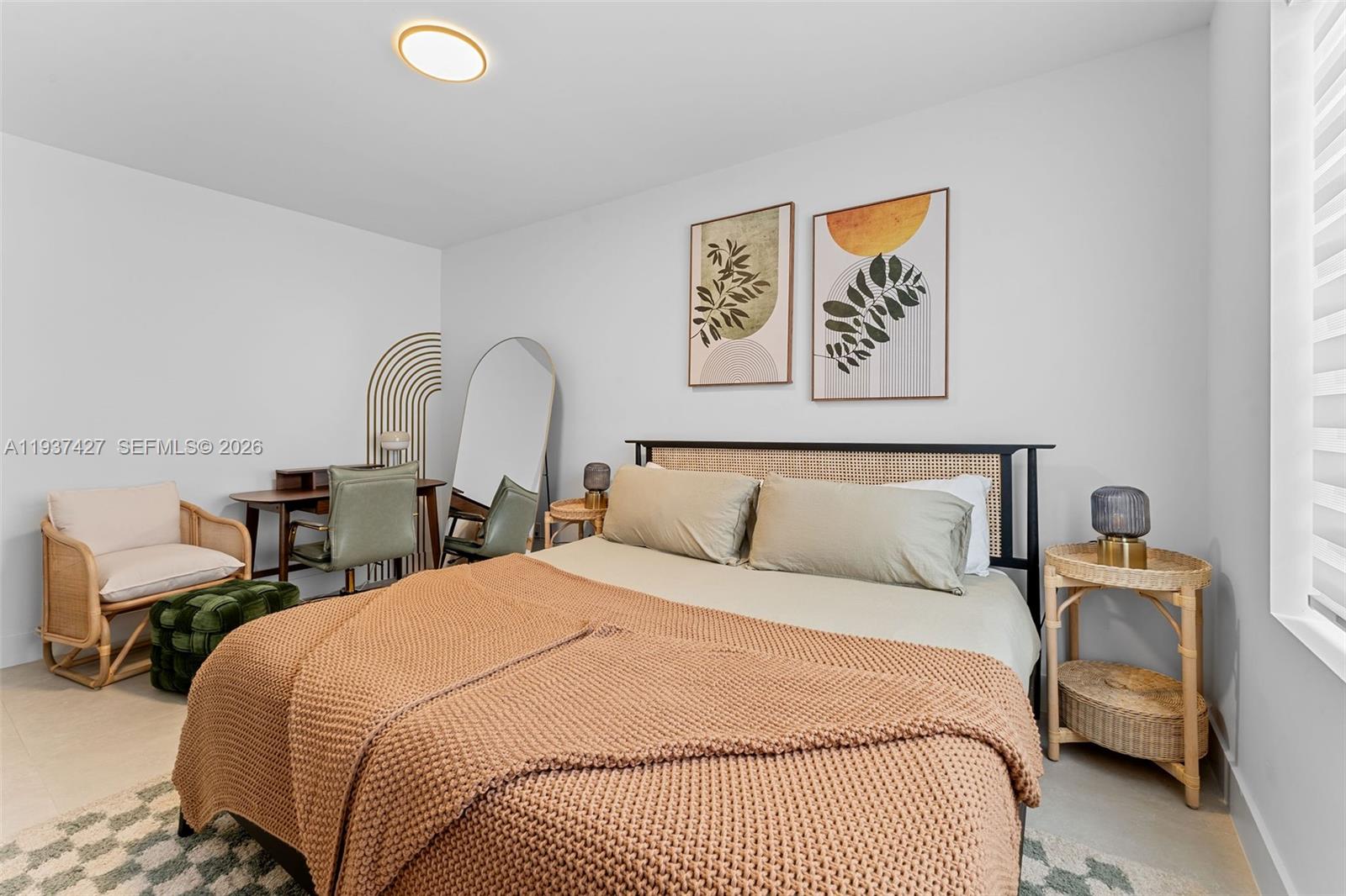 1144 Southwest 4th Street, Unit 8 Miami, FL 33130 - Photo 11 of 16 a bedroom with a bed and a couch