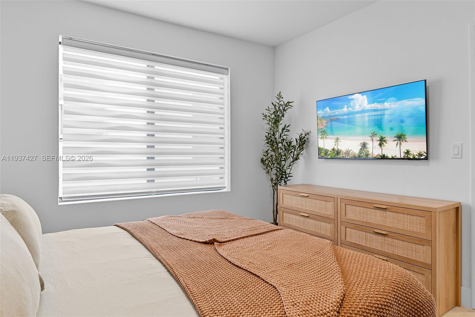 1144 Southwest 4th Street, Unit 8 Miami, FL 33130 - Photo 12 of 16 a bedroom with a bed and a window