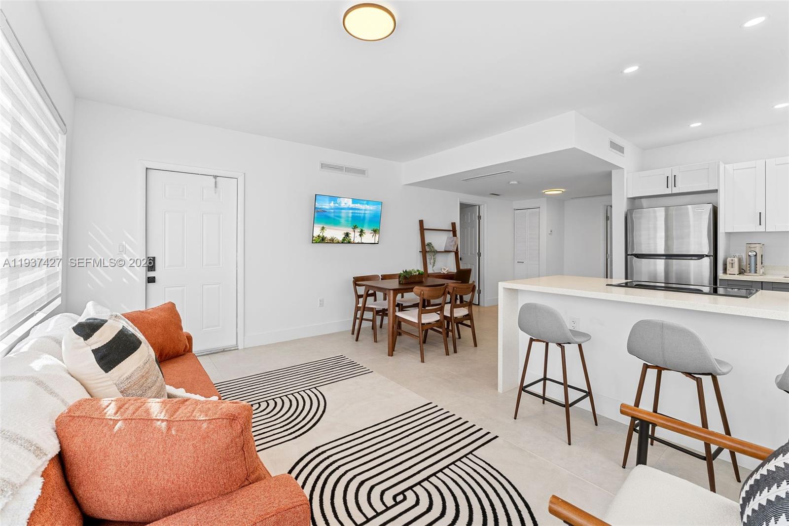 1144 Southwest 4th Street, Unit 8 Miami, FL 33130 - Photo 2 of 16 a living room with furniture and a potted plant