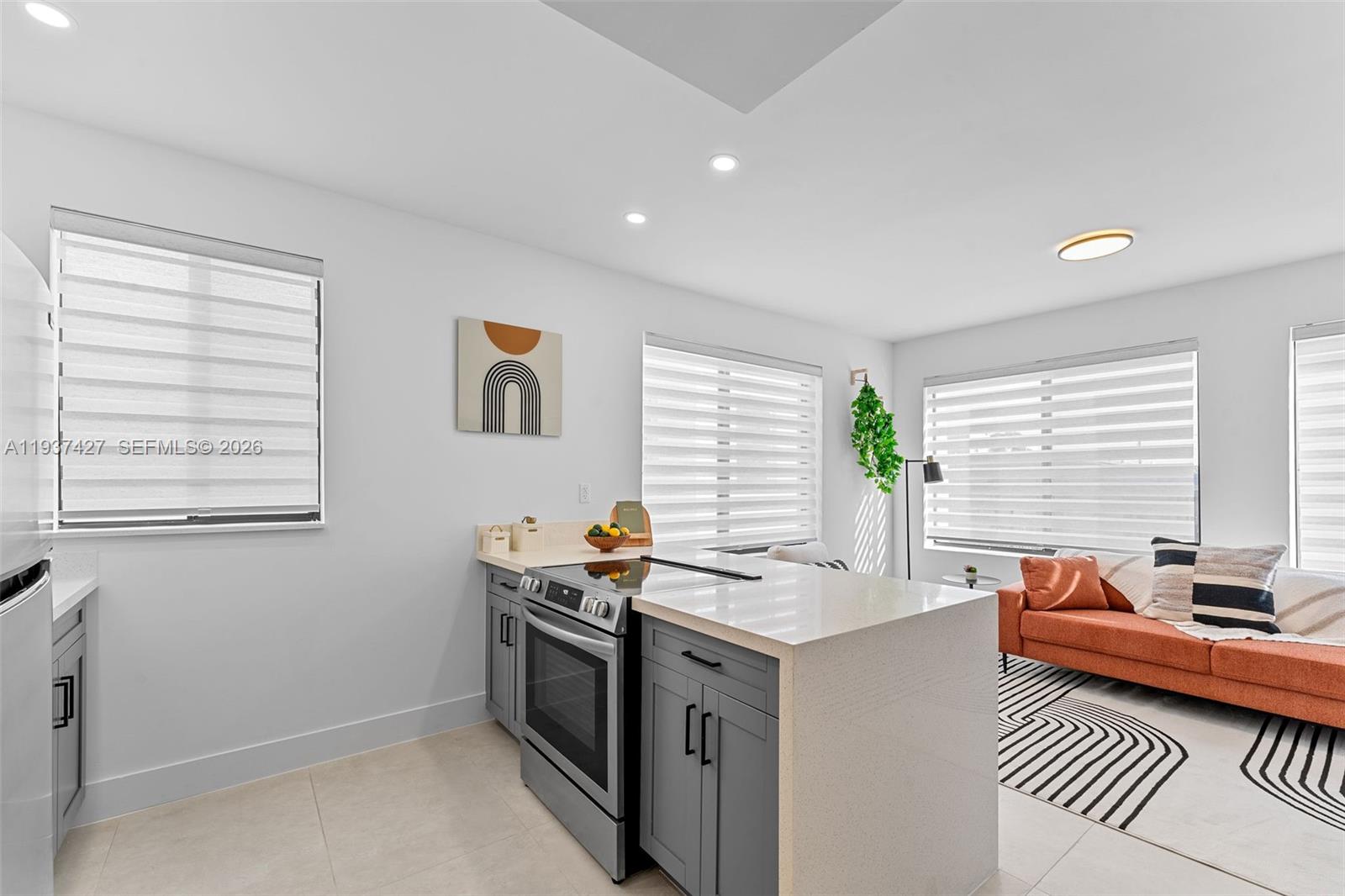 1144 Southwest 4th Street, Unit 8 Miami, FL 33130 - Photo 5 of 16 a view of a workspace with furniture and a window