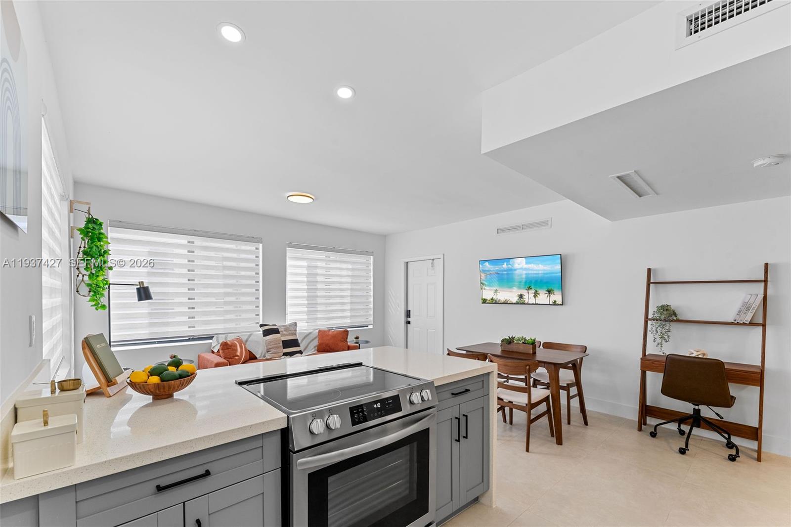 1144 Southwest 4th Street, Unit 8 Miami, FL 33130 - Photo 6 of 16 a view of a workspace with furniture and a window