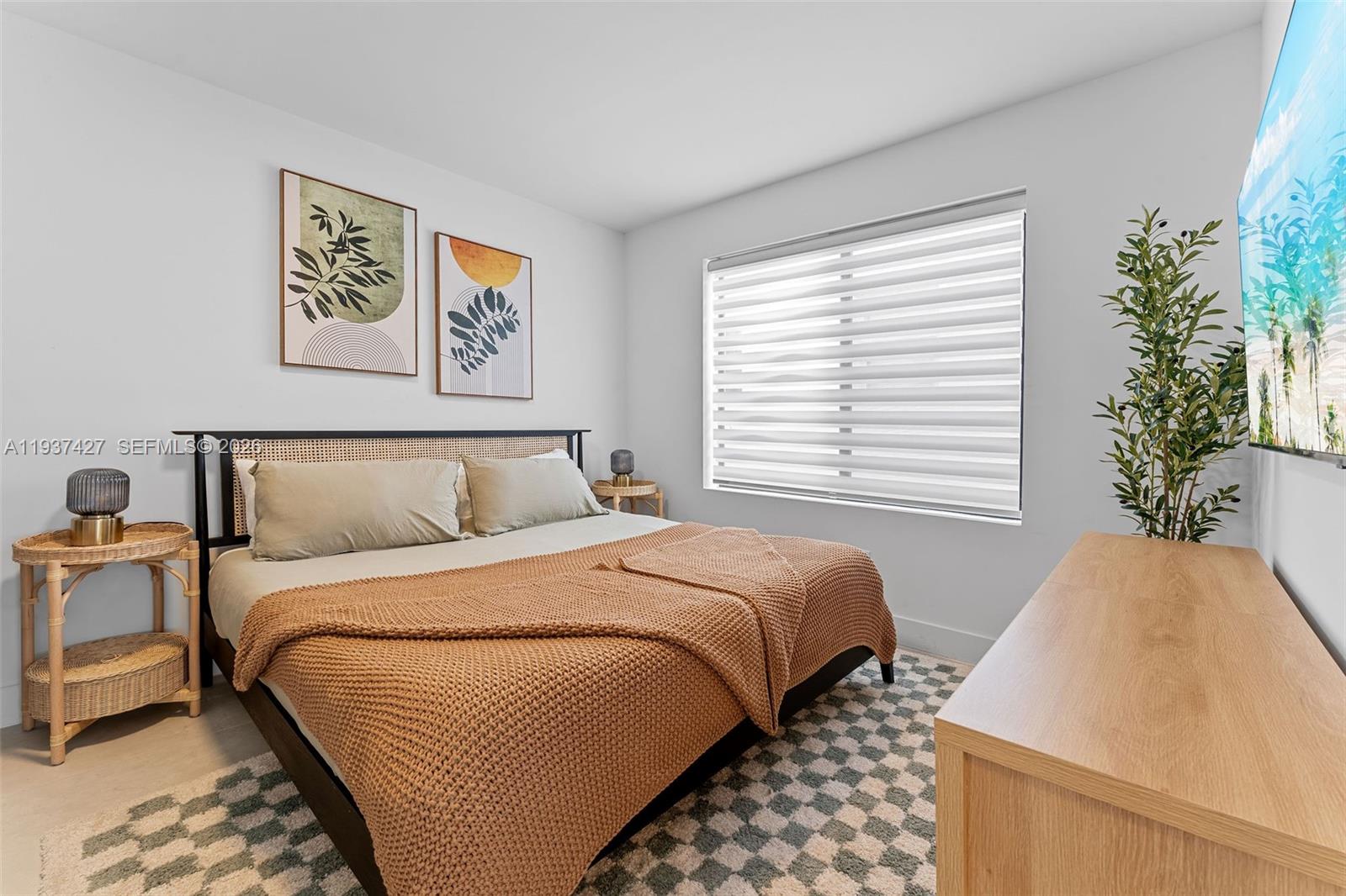 1144 Southwest 4th Street, Unit 8 Miami, FL 33130 - Photo 10 of 16 a bedroom with bed and a window