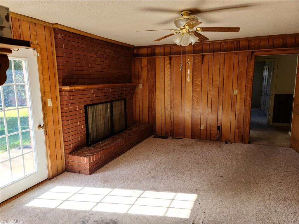 4862 Murray Road Winston-Salem, NC 27106 - Photo 2 of 22 Den off kitchen with wood burning FP