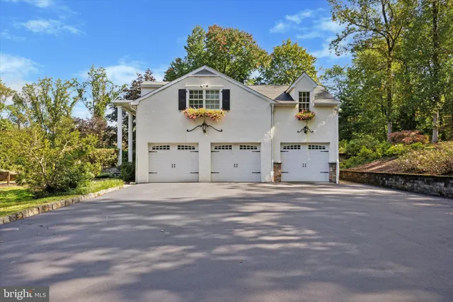 a view of a swimming pool with a yard and sitting space