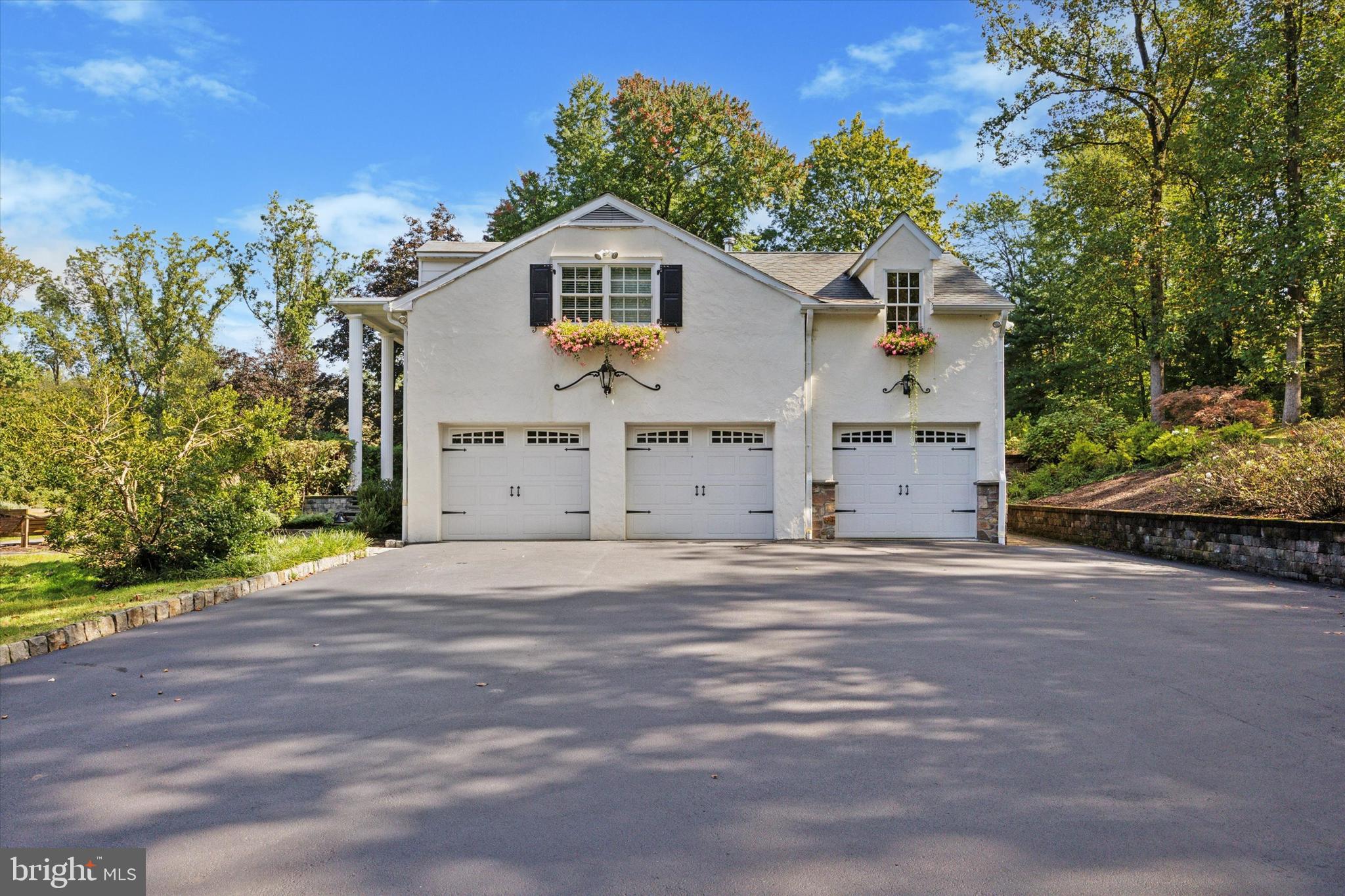 4104 Tinker Hill Road Phoenixville, PA 19460 - Photo 15 of 63 a front view of a house with a yard and garage