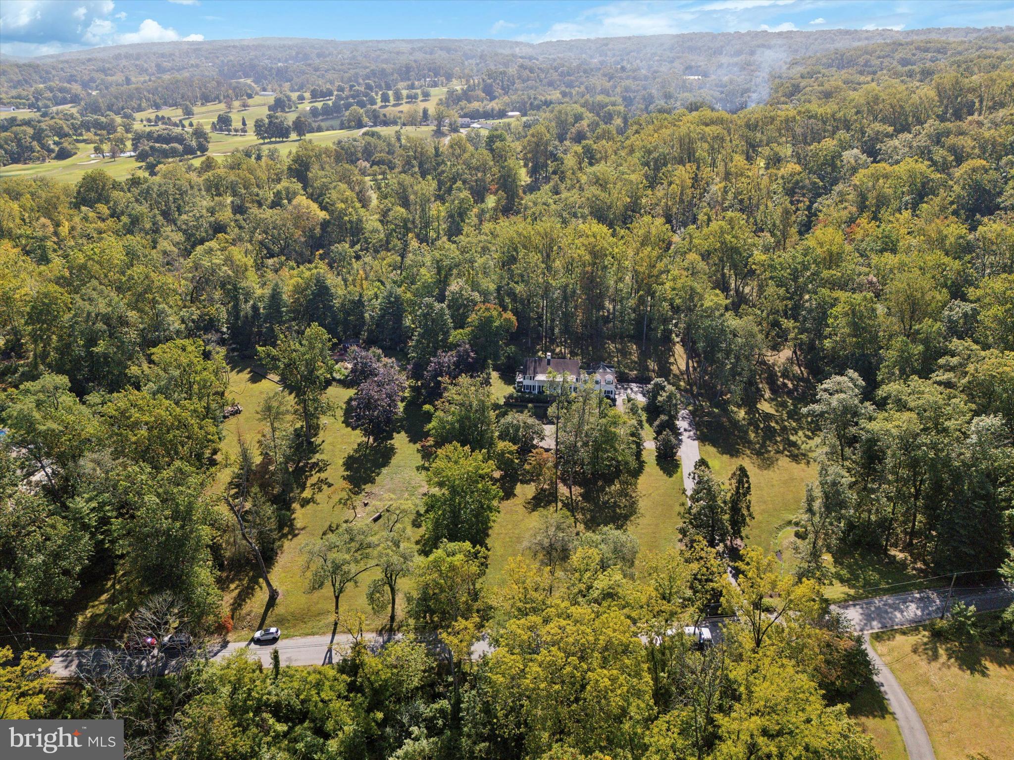 4104 Tinker Hill Road Phoenixville, PA 19460 - Photo 23 of 63 an aerial view of residential houses with outdoor space and trees