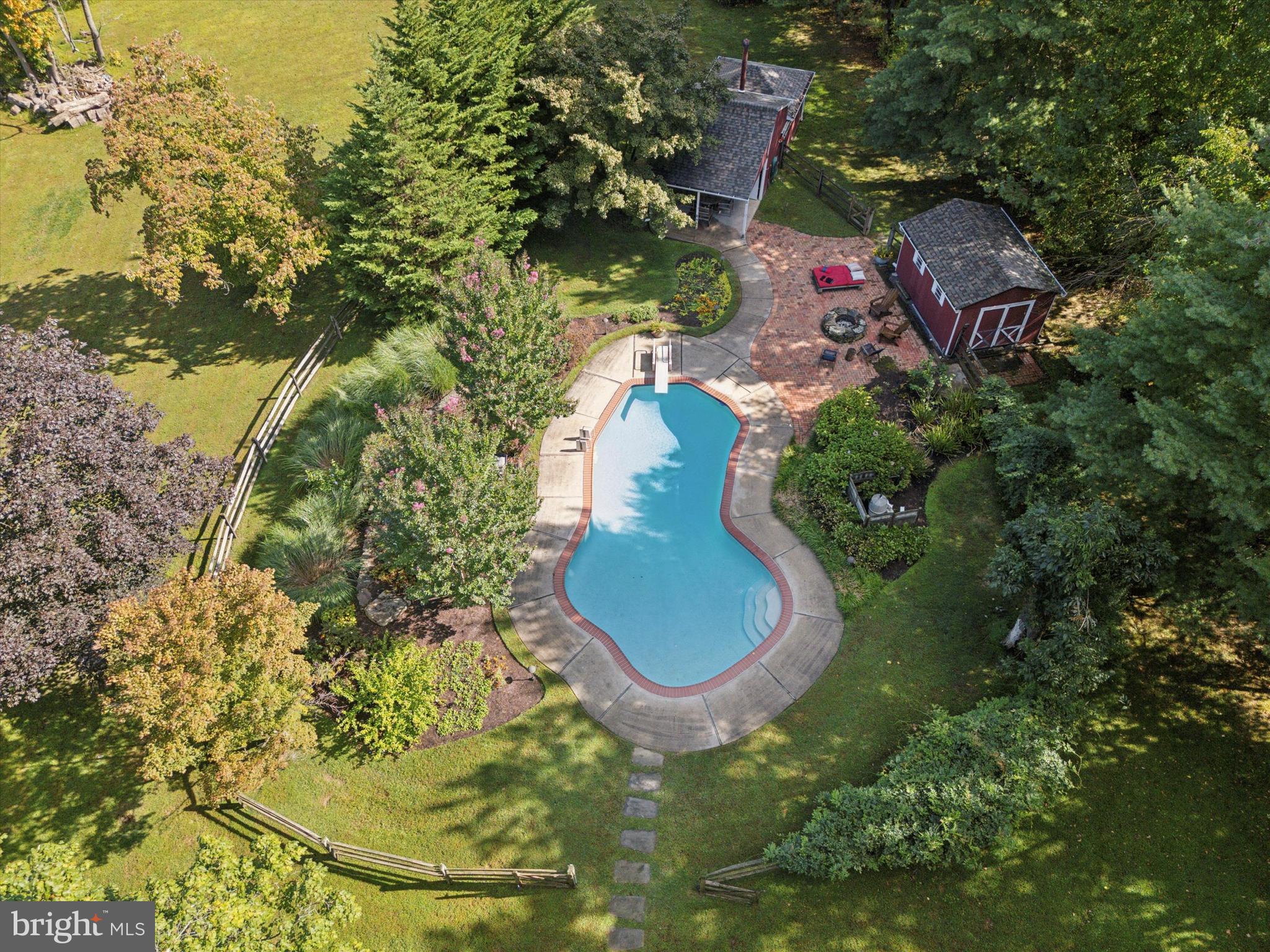4104 Tinker Hill Road Phoenixville, PA 19460 - Photo 25 of 63 an aerial view of a house with a yard and large trees