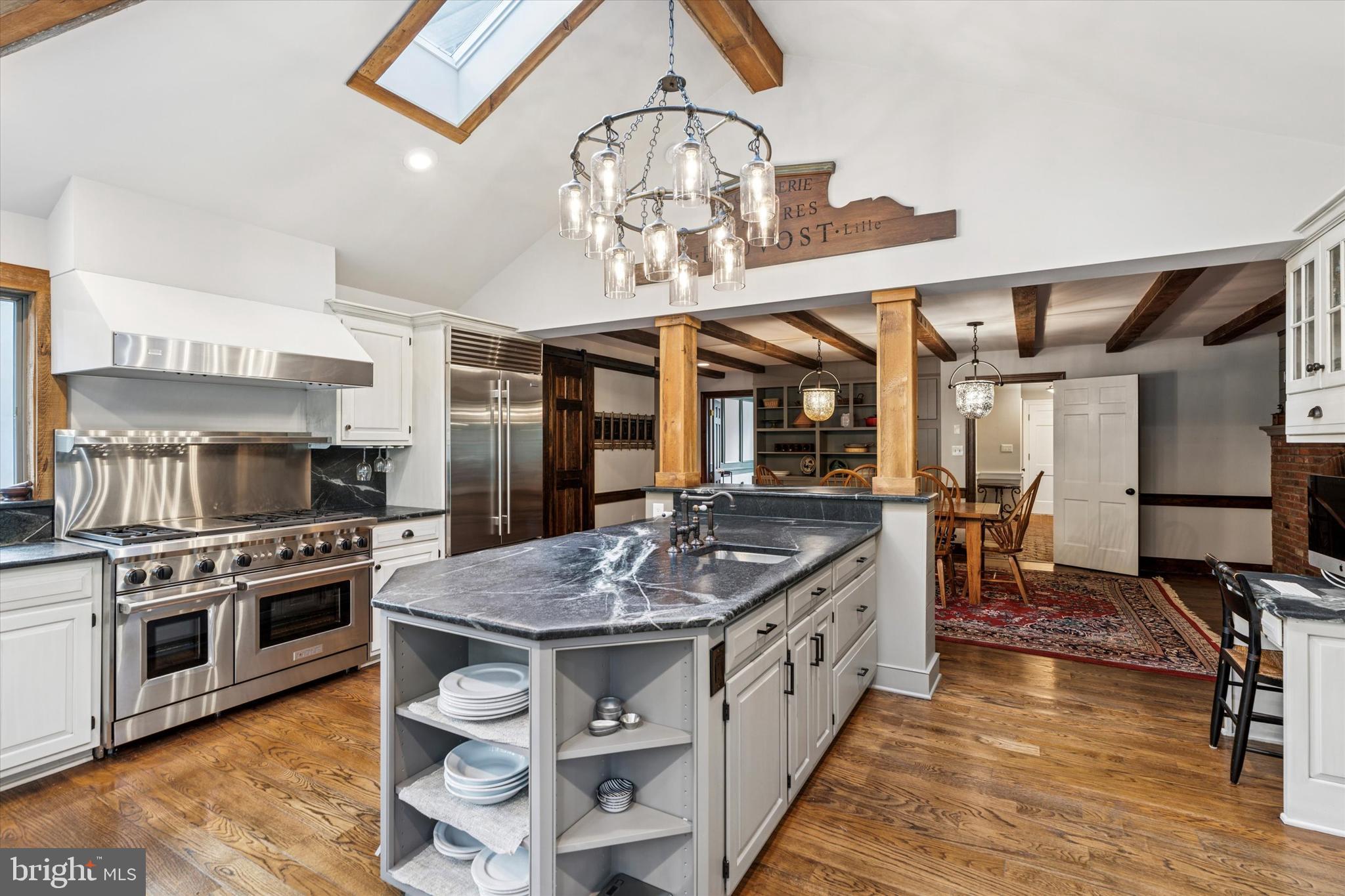 4104 Tinker Hill Road Phoenixville, PA 19460 - Photo 32 of 63 a kitchen with a stove and a wooden floors