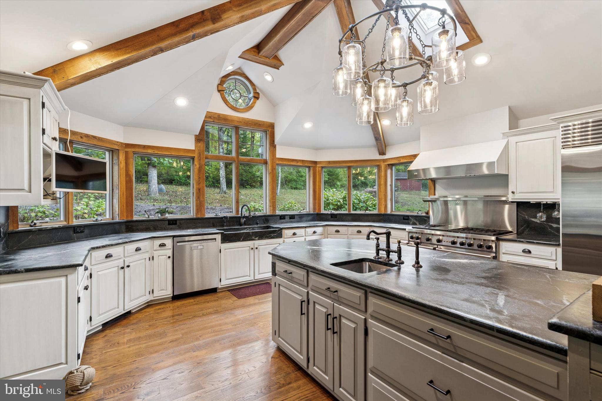 4104 Tinker Hill Road Phoenixville, PA 19460 - Photo 33 of 63 a kitchen with stainless steel appliances a sink and a large window