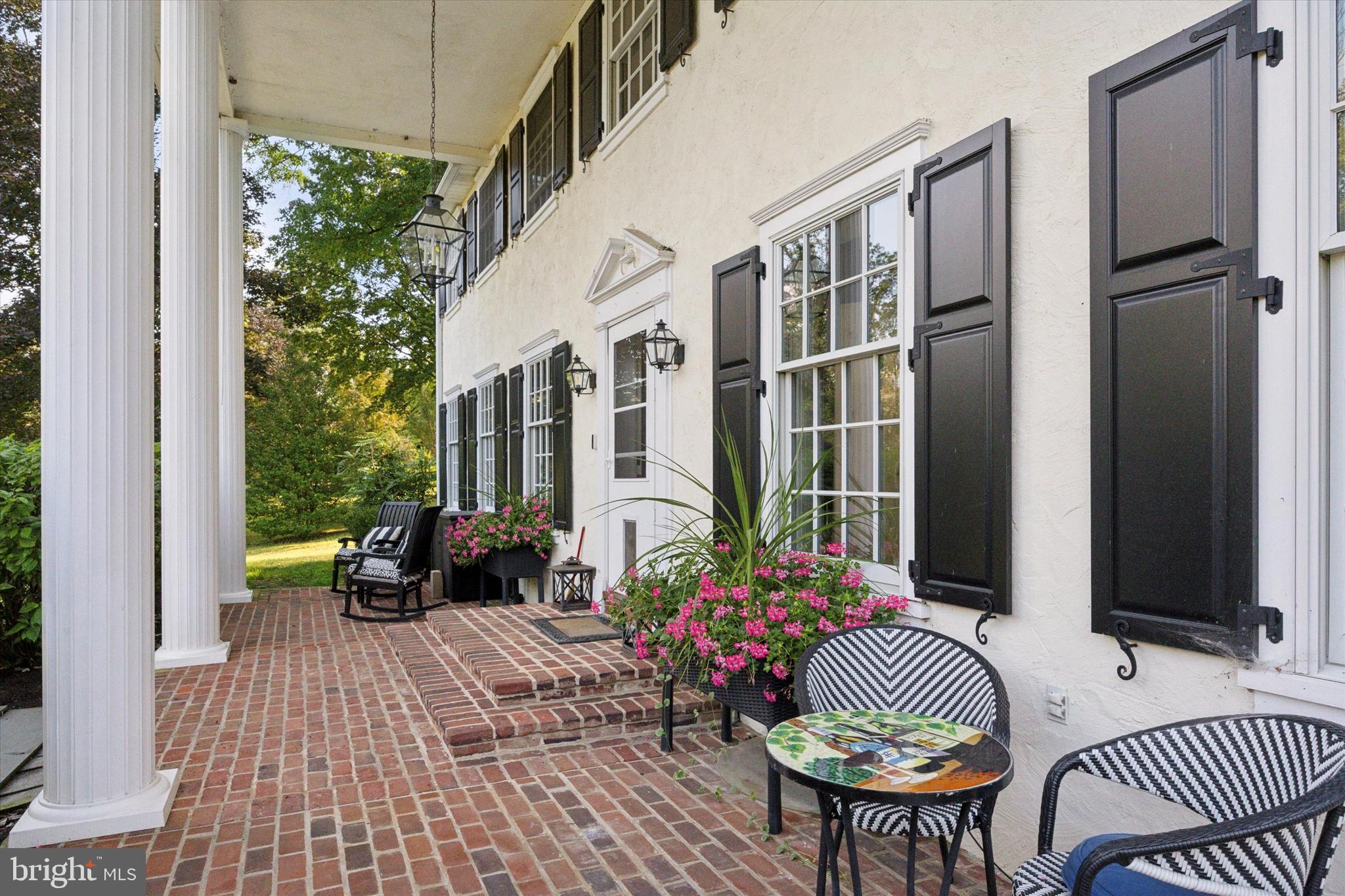 4104 Tinker Hill Road Phoenixville, PA 19460 - Photo 4 of 63 a view of a patio with couches table and chairs and potted plants