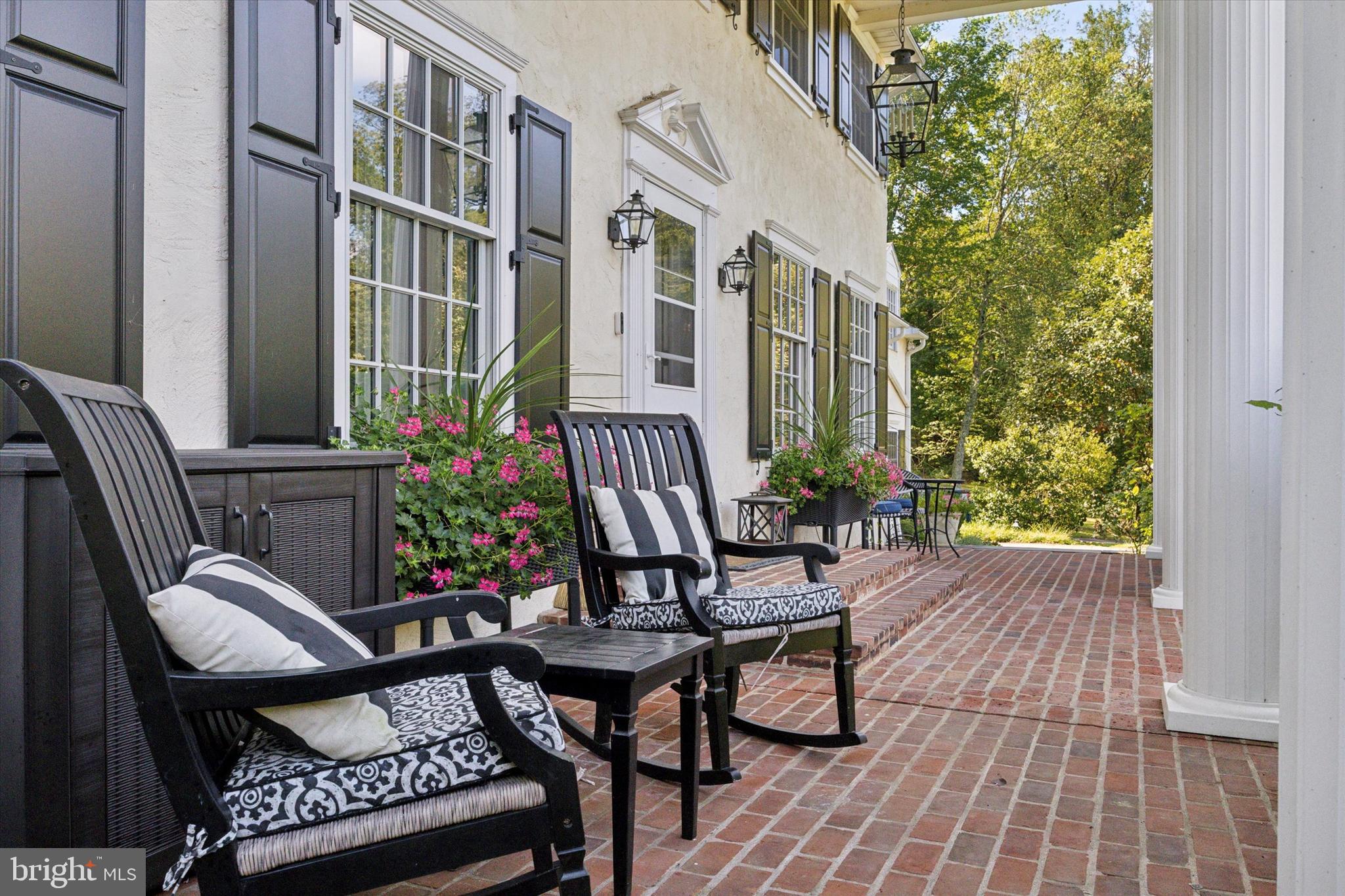 4104 Tinker Hill Road Phoenixville, PA 19460 - Photo 5 of 63 a view of a patio with table and chairs and potted plants